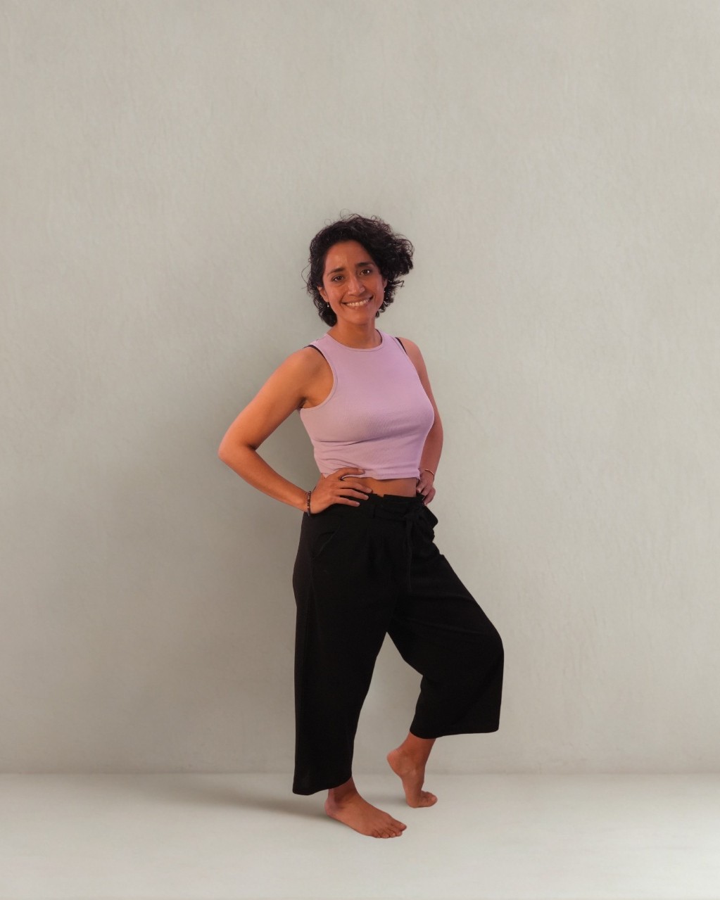 Nadia Tapia, founder of Abrazo Studio, in a sunlit Helsinki studio